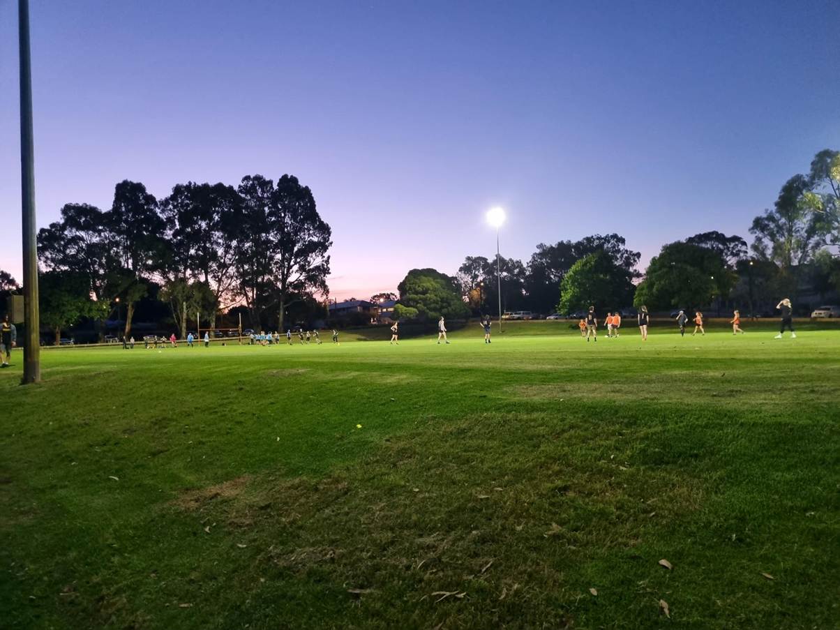 A group of people playing football in a park
AI-generated content may be incorrect.
